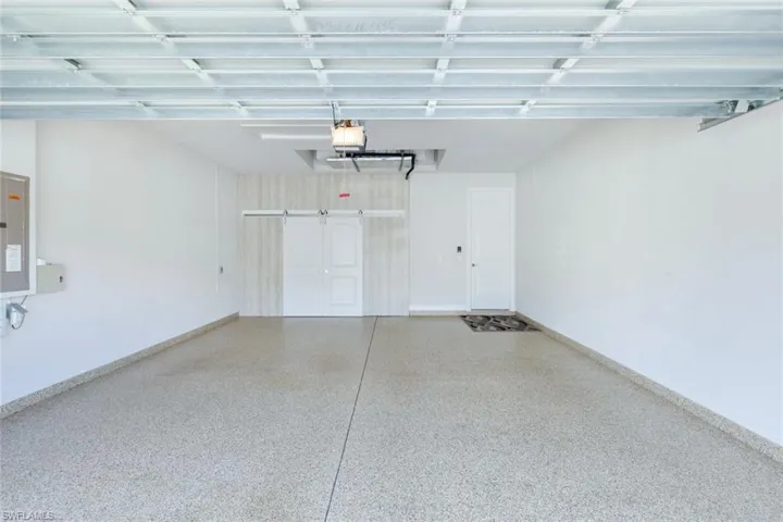 Garage featuring a garage door opener