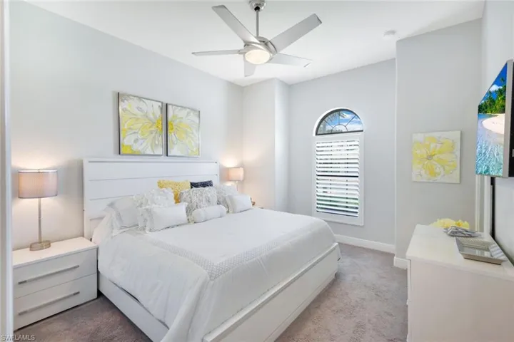 Bedroom featuring carpet and ceiling fan