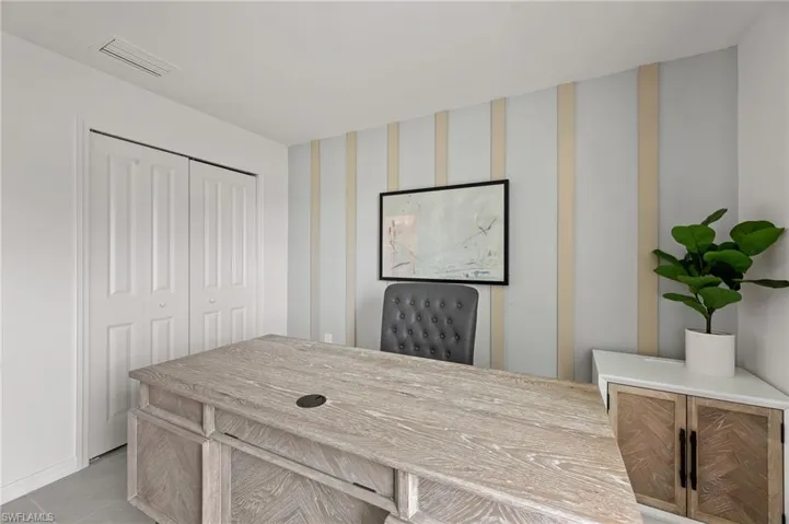 Home office with light tile patterned floors