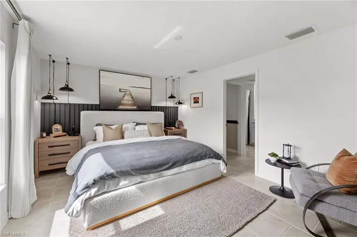 Bedroom with light tile patterned floors