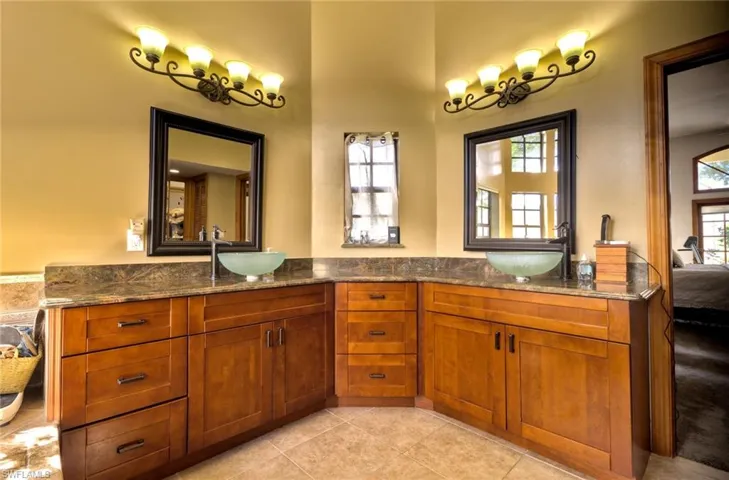 Master Bathroom with double vanity and tile flooring