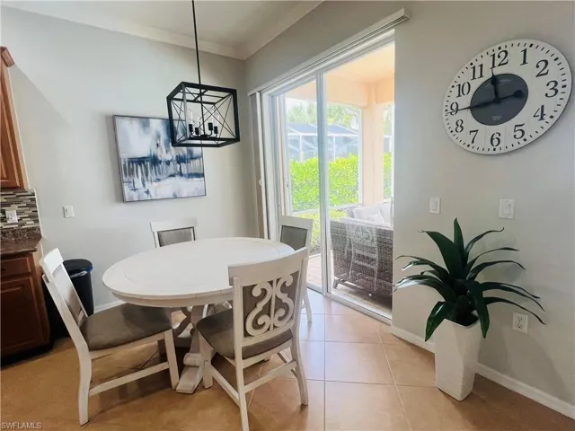 Tiled dining space with ornamental molding