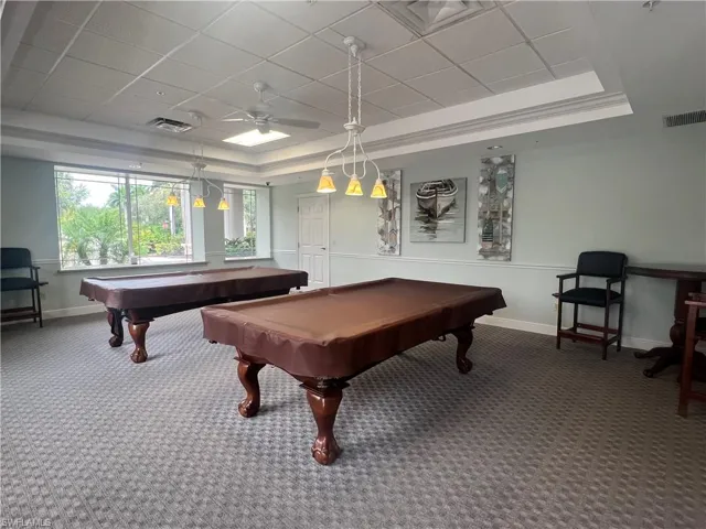 Recreation room featuring crown molding, carpet floors, ceiling fan, a tray ceiling, and billiards