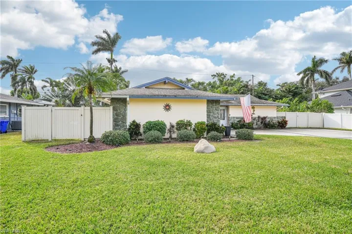 Single story home with a front lawn