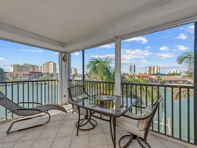 Sunroom / solarium with a water view