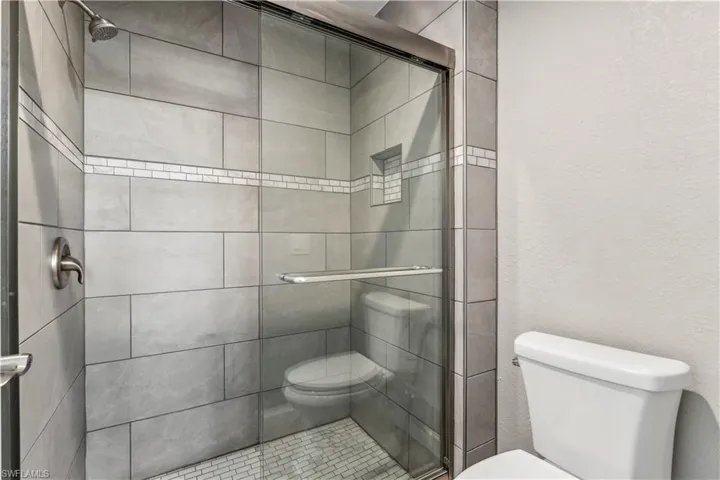 Bathroom featuring a shower with shower door