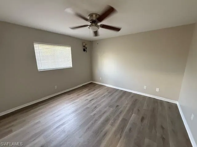Walk in closet with new LV flooring.