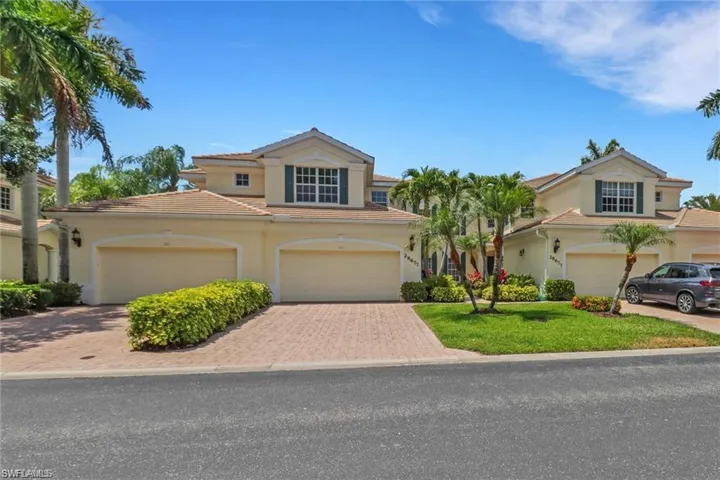 Mediterranean / spanish-style home with a garage