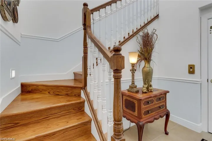 Staircase with tile patterned floors