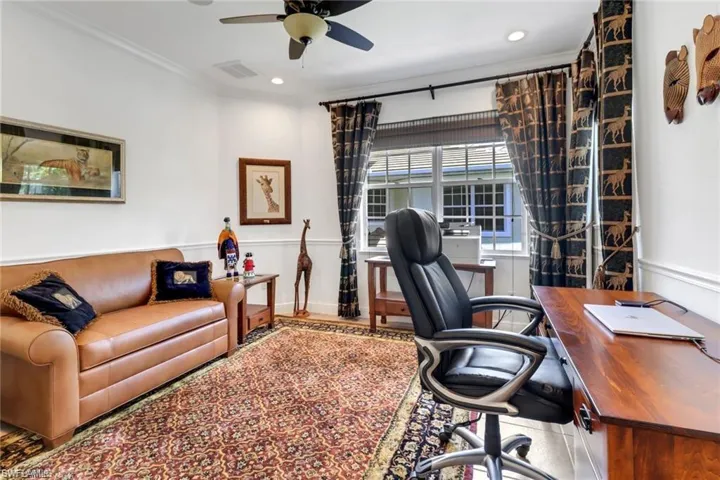 Office featuring ceiling fan and crown molding
