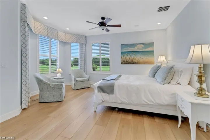 Bedroom featuring ceiling fan and light hardwood / wood-style floors