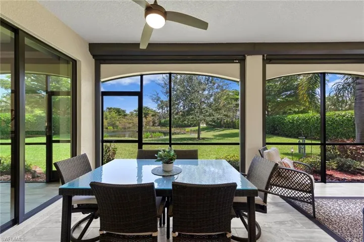 Tiled lanai featuring a water view