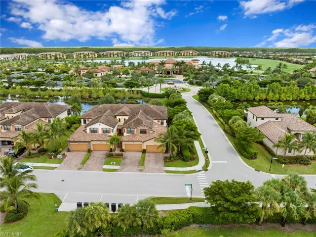 Ariel of home with clubhouse and amenity center in the background