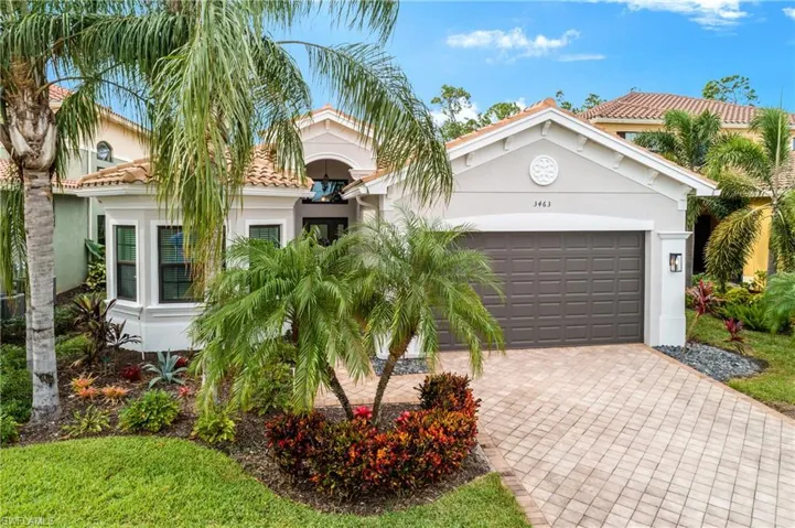 Mediterranean / spanish-style house featuring a garage
