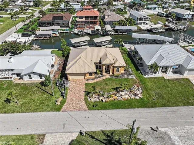 Aerial perspective of suburban area featuring the canal and main road to Saint James City and all the fun it has to offer.