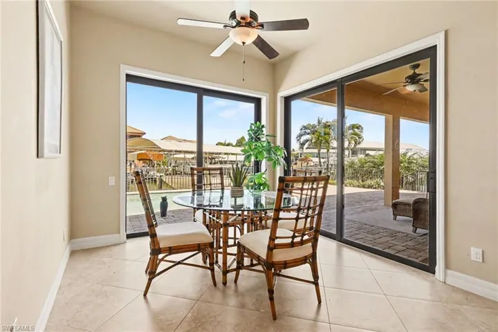 Dining area with baseboards and a ceiling fan