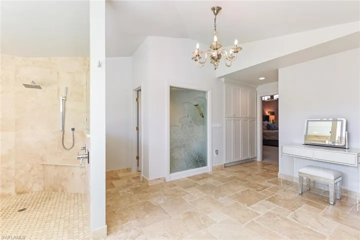 Large walk-in shower with rain pan shower head
