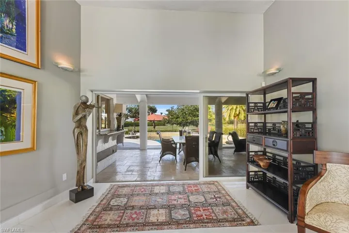 Triple sliders out to the lanai from the formal dining area.