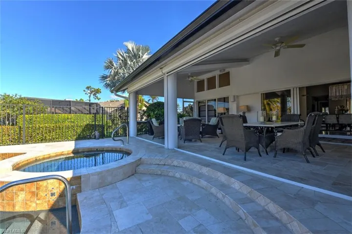 View of patio / terrace featuring electric roll down screens at each opening,