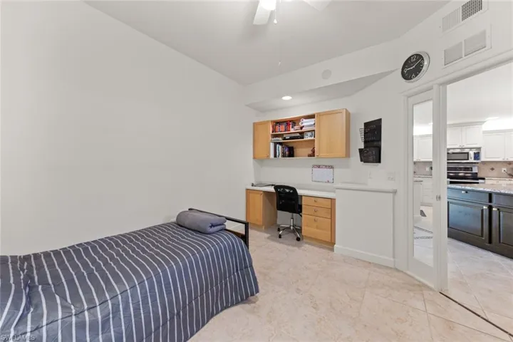 Den With Built in Desk and Cabinets