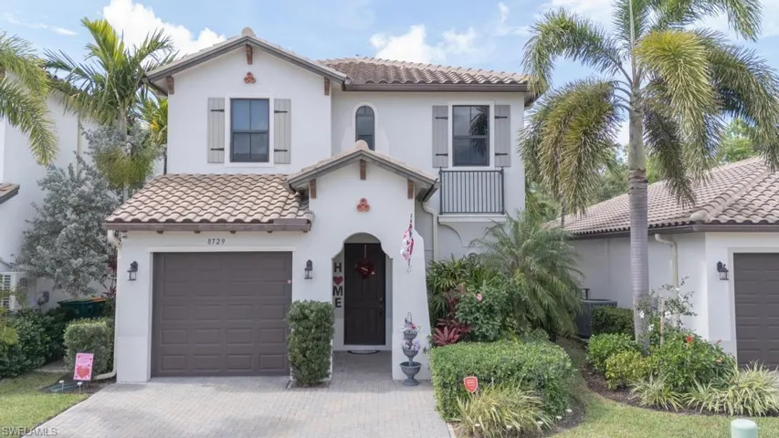 Mediterranean / spanish home with a garage
