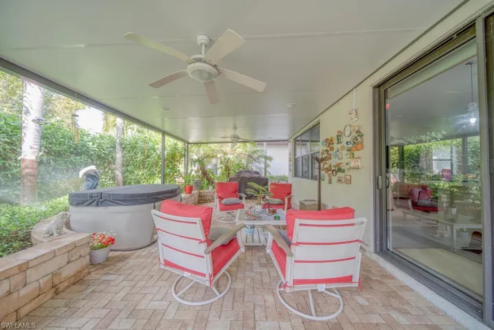 Sunroom featuring ceiling fan