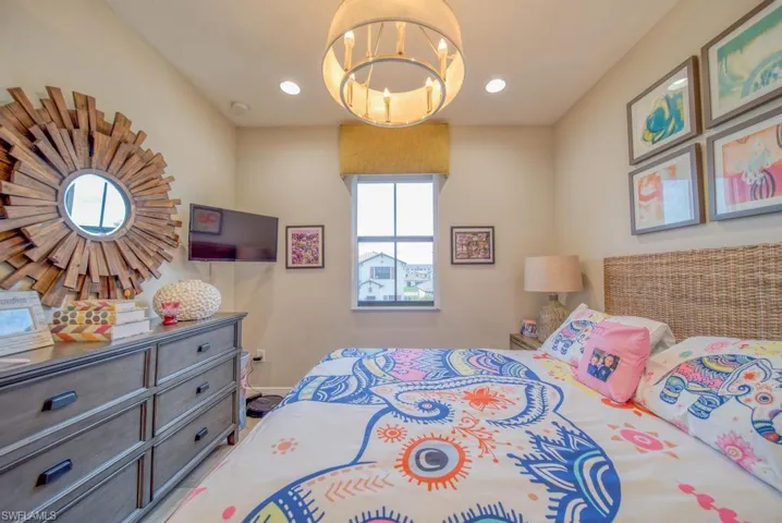 Bedroom featuring an inviting chandelier