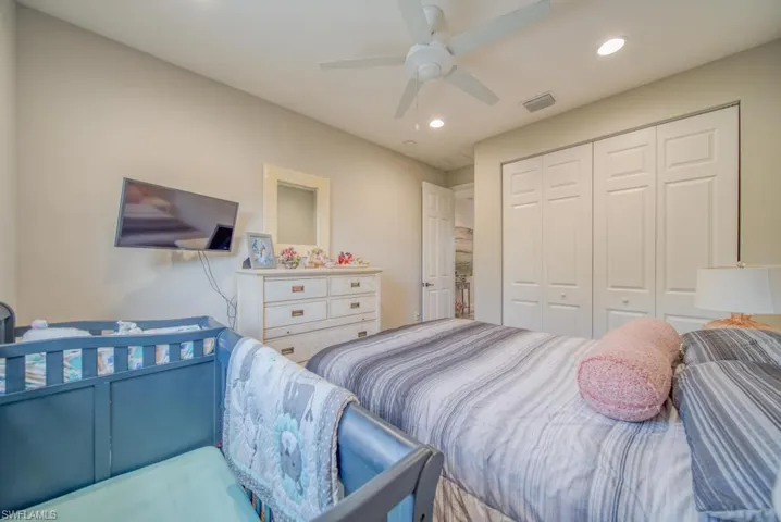 Bedroom featuring ceiling fan and a closet