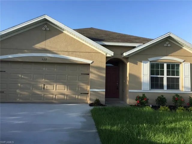 Ranch-style house featuring a garage