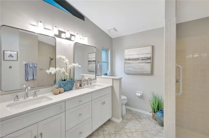 updated primary bathroom with raised counters