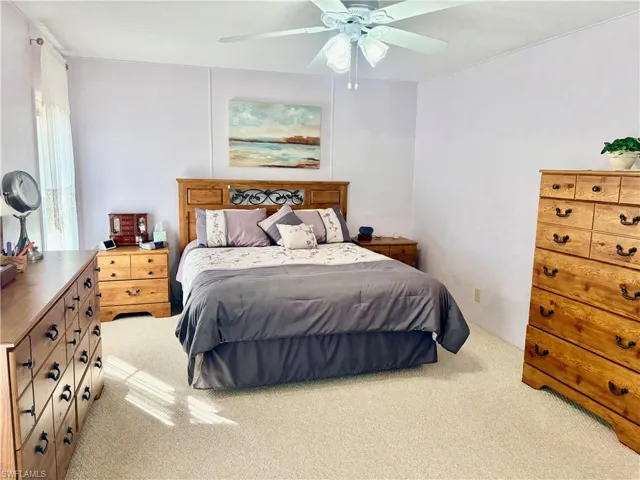 Bedroom with carpet flooring and a ceiling fan