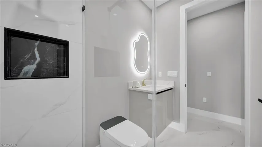 Bathroom with vanity and toilet