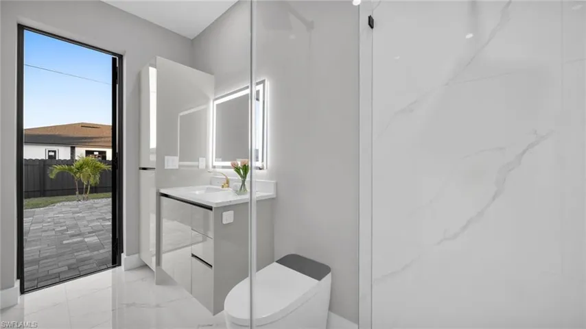 Full bath with vanity and toilet