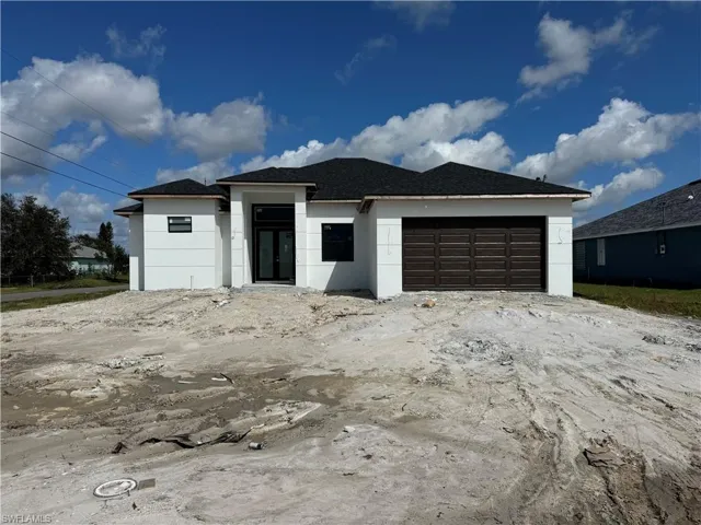 View of front of home with a garage 10/15