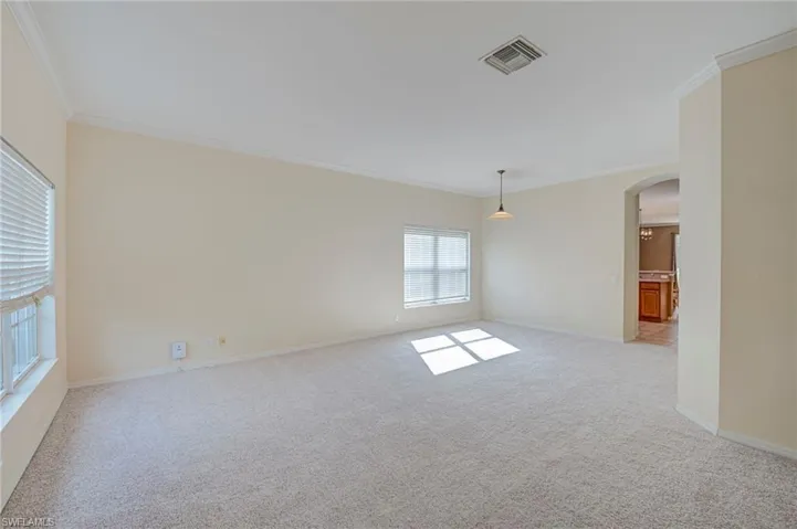 Formal living room and dining room with new carpet