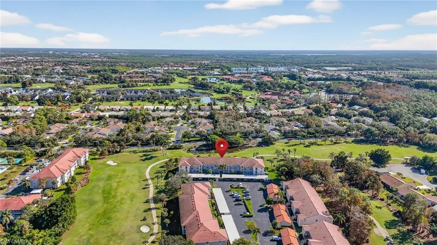 Aerial overview of property's location featuring nearby suburban area and a local golf course