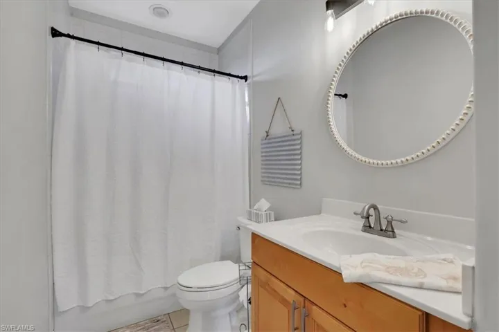 Bathroom featuring vanity and shower / bath combo