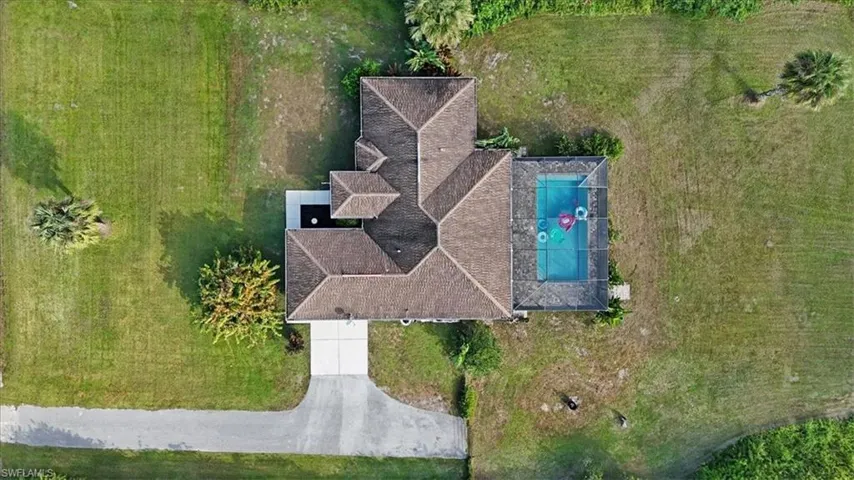 View of subject property with a pool
