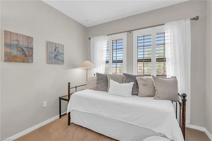 Bedroom with light carpet
