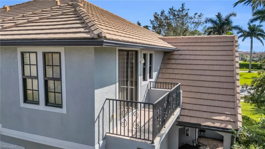 View of home's exterior with a balcony