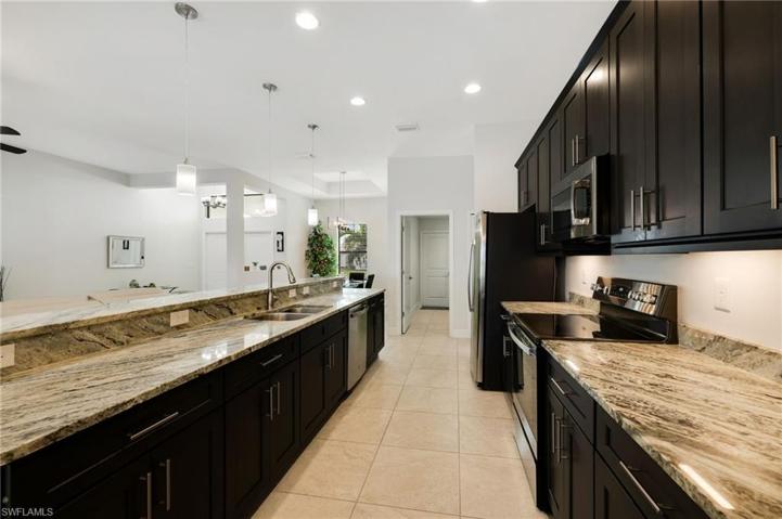 More gorgeous granite and a double sink w/disposal