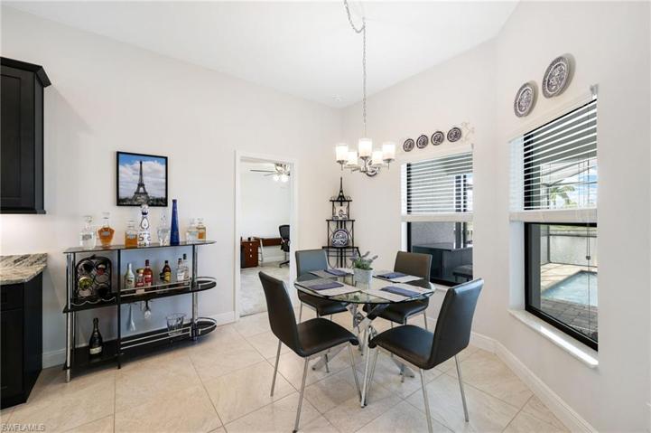 A convenient kitchen dining area with a serene view