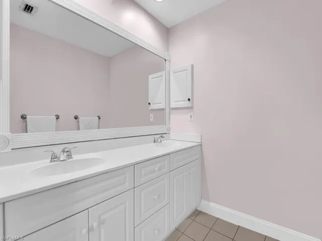 Bathroom with vanity and tile patterned flooring