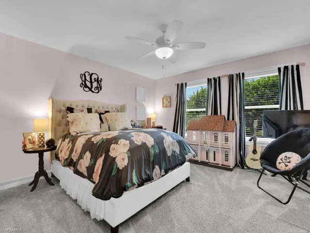 Bedroom featuring carpet and ceiling fan