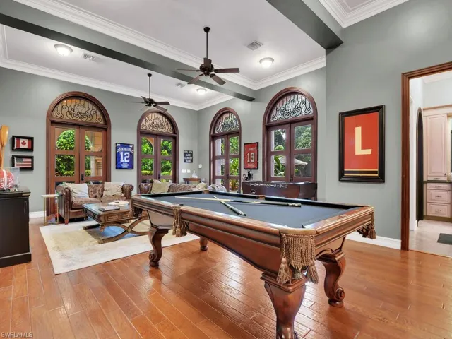 Rec room with a healthy amount of sunlight, wood-type flooring, and pool table