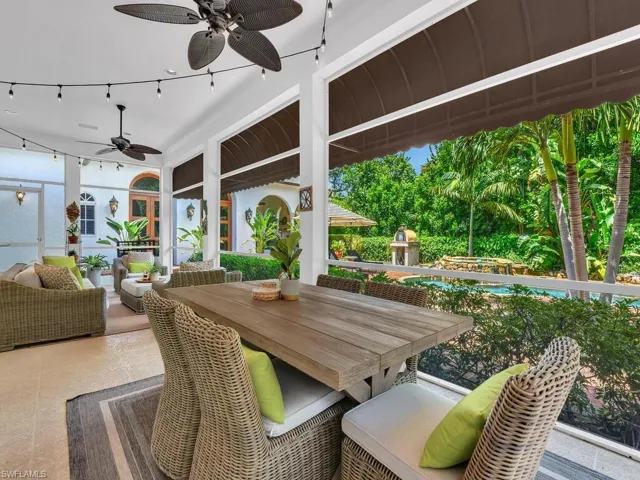 View of patio with an outdoor living space, a swimming pool, and ceiling fan