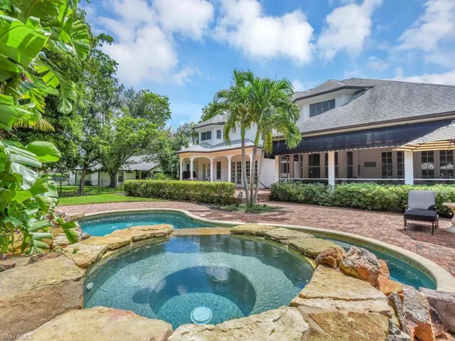 View of pool featuring an in ground hot tub and a patio area