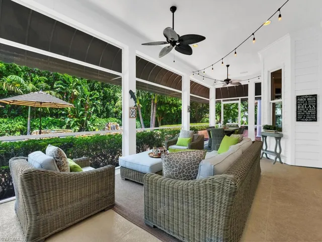 Sunroom / solarium featuring ceiling fan