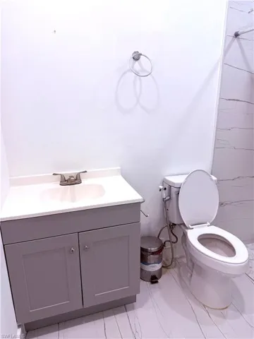 Full bath with vanity and a shower