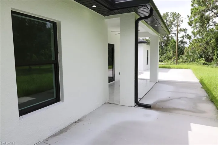 Doorway to property with french doors and stucco siding